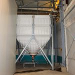 Vis de transfert à la base d'un silo souple textile