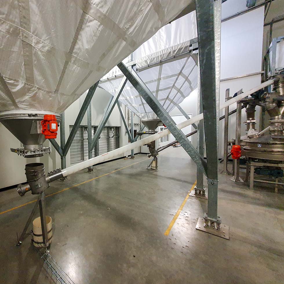 Système de vis souple pour le transport de granulés depuis un silo souple